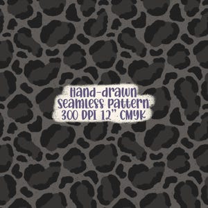 May include: A seamless pattern featuring dark gray leopard spots on a gray background. The text in the image reads "Hand-drawn seamless pattern 300 DPI 12" CMYK". This pattern is suitable for various design projects.