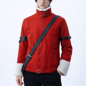 May include: A red jacket with a high collar, a black strap across the body, and black armbands. The jacket has a zip closure and white faux fur cuffs. The person is wearing black trousers.