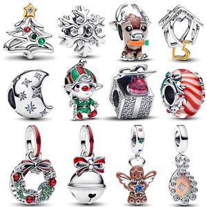 May include: A collection of silver-toned Christmas-themed charms. Designs include a Christmas tree, snowflake, reindeer, house, crescent moon, elf, gift box, candy cane, wreath, bell, gingerbread angel, and teardrop.