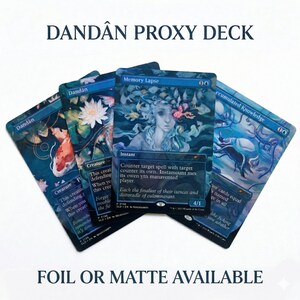 May include: Four fantasy trading cards with detailed illustrations in blue, teal, and purple. The cards feature the text "DANDÂN PROXY DECK" and "FOIL OR MATTE AVAILABLE". The cards are designed for gameplay and have unique artwork.