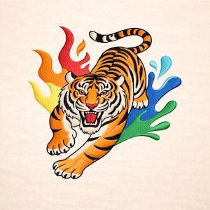 May include: Embroidered tiger design in orange, black, and white, with a roaring expression. The tiger is surrounded by colorful splashes of red, orange, yellow, green, and blue. The design is on a cream-colored background.