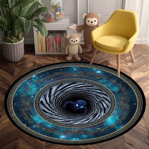 May include: Round area rug with a celestial design featuring a swirling vortex and a blue alien figure. The rug has a dark blue border with gold accents and a starry sky pattern, creating a unique and eye-catching floor covering.
