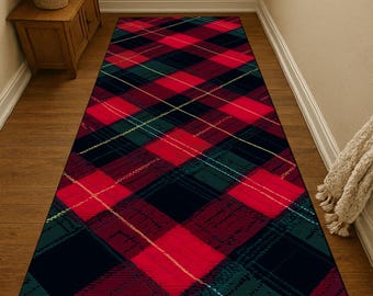 May include: A rectangular plaid rug in red, green, black, and gold. The rug features a classic tartan pattern, with intersecting lines creating a grid-like design. The rug is placed on a wooden floor, adding warmth to the space.