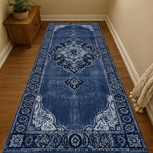 May include: A rectangular runner rug featuring a deep blue and white color palette with a central ornate medallion pattern, intricate floral motifs, and a decorative border design that spans the length of the floor covering.
