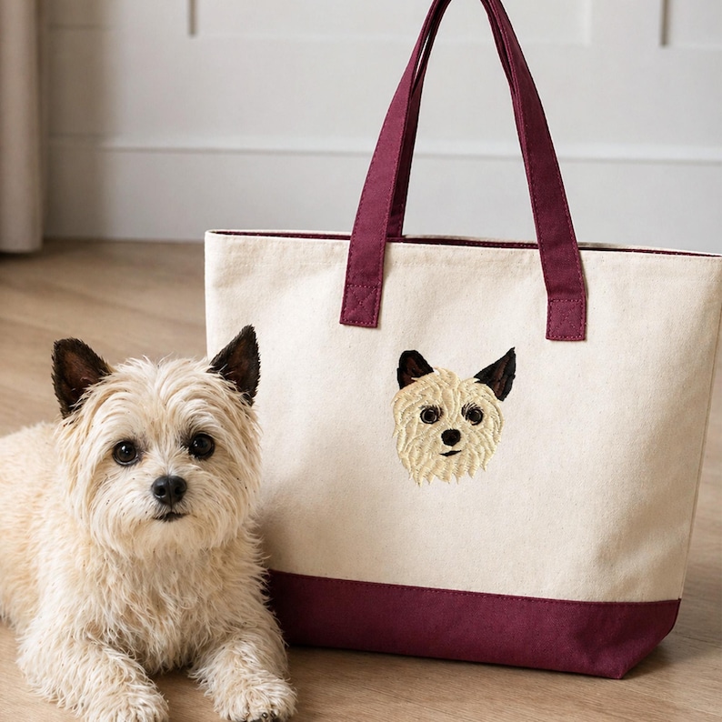 Carmel Classic Cotton Canvas Resort Tote Q1300 in natural/maroon canvas with straps, placed beside small dog. Features custom embroidered pet portrait design. Personalized dog tote bag, custom pet gift idea, durable canvas handbag, stylish and functional tote for everyday use.