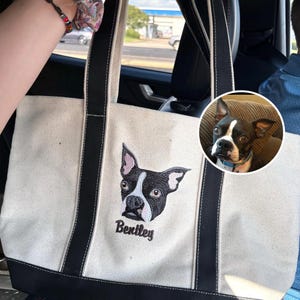 Close-up of Carmel Classic XL Cotton Canvas Resort Tote 8872 in natural/back canvas straps, featuring custom embroidered Boston Terrier portrait and name “Bentley.” High-quality pet portrait embroidery with realistic stitching detail. Personalized dog tote bag, custom pet gift, embroidered canvas tote for dog lovers, everyday carry bag.