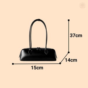 May include: Black rectangular handbag with two handles. The bag is 15 cm long, 14 cm wide, and 37 cm high. The bag has a zipper closure and is made of a shiny material. The handles are long and arched.