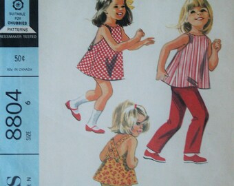 McCall's UNCUT 60’s Girl Flared Criss Cross Back Dress or Top &  Pull on Shorts or Pants 8804 Sewing Pattern Size 6