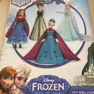 May include: A Simplicity home sewing pattern featuring Disney's Frozen characters. The pattern includes images of dolls in various outfits, with the Disney Frozen logo prominently displayed. The pattern is for 11 1/2" doll clothes.