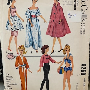 May include: Vintage McCall's doll clothes pattern, featuring illustrations of various outfits for Barbie and other teen dolls. The pattern includes a dress, coat, robe, and swimwear. The pattern is labeled "instant" and includes the price.