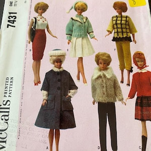 May include: Vintage Barbie doll clothing pattern featuring multiple outfits. The pattern includes instructions for knitting doll clothes. The cover displays various Barbie dolls in different outfits, including coats, skirts, and sweaters. The pattern is marked with the Barbie logo and the price.