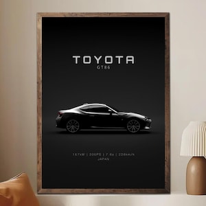May include: A framed print featuring a black Toyota GT86 sports car against a dark background. The Toyota logo and model name are displayed above the car. Technical specifications are listed below the car, including 205PS and 226km/h.
