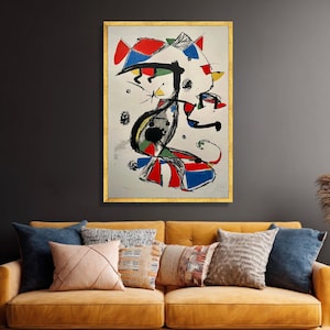 Pode incluir: Impressão de arte abstrata em uma moldura dourada. A obra apresenta um design caprichoso com cores vibrantes, incluindo vermelho, azul, preto e amarelo. A composição tem uma qualidade lúdica e surrealista, com formas geométricas e orgânicas.