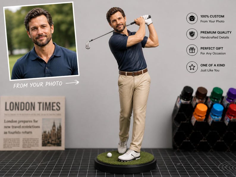May include: A figurine of a golfer in a navy blue polo shirt and khaki pants, mid-swing with a golf club. The figure stands on a green base with a golf ball. The image includes a photo of a man and text that reads "FROM YOUR PHOTO".