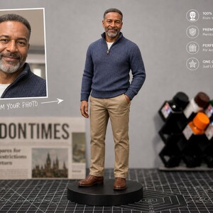 May include: A custom figurine of a man in a blue sweater and khaki pants, standing on a black base. The image includes a framed photo and text that reads "FROM YOUR PHOTO." The background features a newspaper and a rack of colorful bottles.