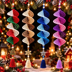 May include: Four hanging spiral crochet ornaments in red and green, tan and cream, blue and light blue, and purple and pink. Each features a beaded string, a metal charm—a tree, snowflake, star, or moon—and a matching colored tassel.