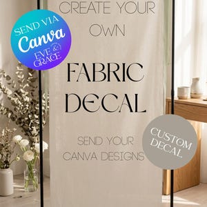 May include: A fabric decal with the text "CREATE YOUR OWN FABRIC DECAL" and "SEND YOUR CANVA DESIGNS". The design includes a Canva logo and a "CUSTOM DECAL" label. The decal is displayed on a black stand.