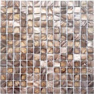 May include: A mosaic tile sheet composed of numerous small, square tiles. The tiles exhibit a range of neutral tones, including beige, brown, and hints of silver, creating a textured, iridescent appearance. The tiles are arranged in a grid pattern.