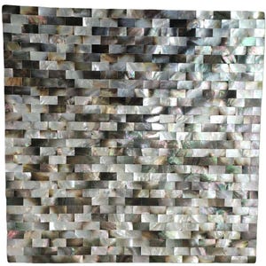 May include: A square mosaic tile pattern composed of small, rectangular pieces. The tiles have a pearlescent sheen with a mix of colors, including white, gray, and brown. The arrangement creates a textured, brick-like appearance, suitable for wall decor.