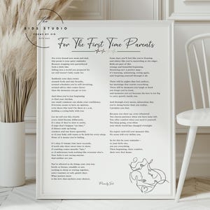 May include: A framed print with the text "For The First Time Parents" in elegant script. The print includes a poem about parenthood, with a minimalist line drawing of a parent and child in the bottom right corner. The frame is white.