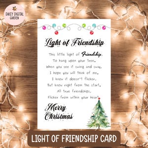May include: A Christmas card with the text "Light of Friendship" and a poem. The card features a watercolor Christmas tree and string lights. The bottom of the card reads "LIGHT OF FRIENDSHIP CARD".