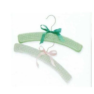 May include: Two crocheted hangers with bows. The hanger on top has a green bow and the hanger on the bottom has a pink bow.