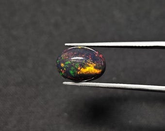 2.20 Carat Black Ethiopian Opal Oval Cabochon 11.5X8MM