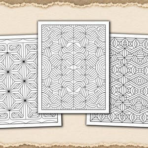 May include: Three rectangular sheets of paper featuring black and white geometric line art patterns. Each sheet displays a unique, intricate design composed of repeating shapes, lines, and symmetrical motifs, presented as a set of coloring pages.