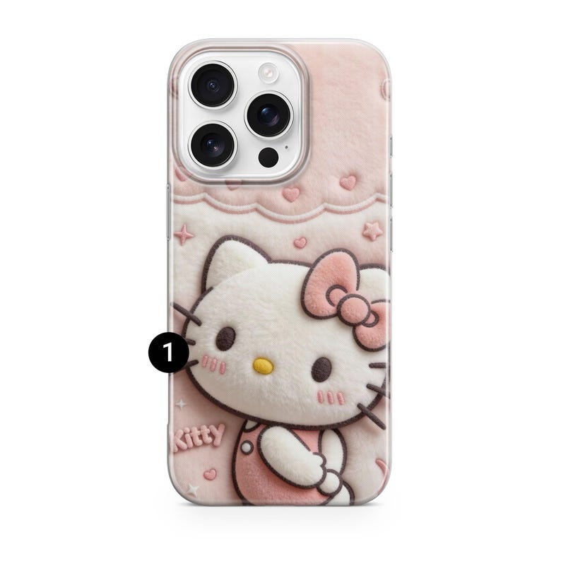 May include: A pink phone case featuring a 3D design of Hello Kitty. The case has a soft, textured appearance with a repeating pattern of hearts and stars. The Hello Kitty character is wearing a pink bow and overalls.