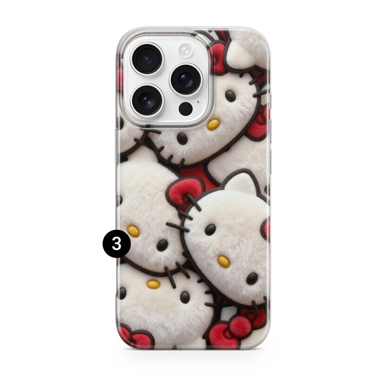 May include: A clear phone case featuring a repeating pattern of white, plush Hello Kitty faces with red bows and black stitched details. The phone case has a clear border and a camera cutout.