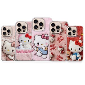 May include: Five phone cases featuring the Hello Kitty character. The cases have a variety of designs, including a plush pink background, Hello Kitty with a snowman, and Hello Kitty in different outfits. The cases are in shades of pink and red.