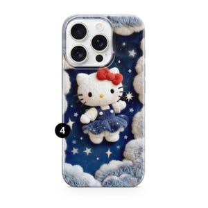 May include: A phone case featuring a 3D design of Hello Kitty in a blue dress with a red bow. The case has a dark blue background with white clouds and stars. The case is designed to fit a smartphone.