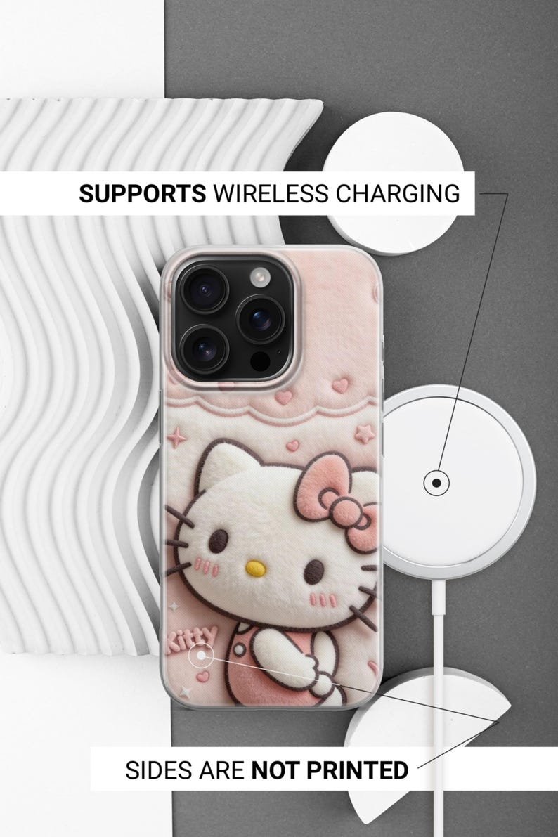 May include: A pink phone case featuring a 3D design of Hello Kitty with a bow. The case has a clear border and the text "SUPPORTS WIRELESS CHARGING" and "SIDES ARE NOT PRINTED".