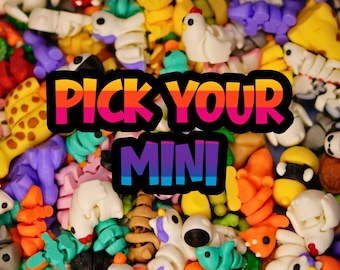 May include: A vibrant assortment of colorful 3D-printed mini figures, including animals and abstract shapes. The image features the text "PICK YOUR MINI" in a rainbow gradient, suggesting a selection of collectible toys.