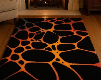 May include: Black area rug with an abstract design in shades of orange and yellow. The rug features a network of interconnected, organic shapes against a black background. The rug is placed in front of a fireplace.