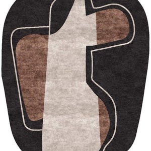 May include: Abstract area rug with a dark gray background and a geometric design in white, beige, and brown. The rug has a unique, organic shape and a modern aesthetic, suitable for living rooms or bedrooms.