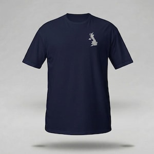May include: Navy blue t-shirt featuring a small, light gray outline of the United Kingdom on the left chest. The short-sleeved shirt is made of a soft material and has a classic crew neck design. A simple, yet stylish garment.