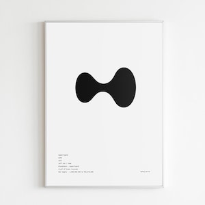 May include: A framed art print featuring a minimalist design. The artwork showcases a large, black, abstract shape centered on a white background. The print includes small text at the bottom left and right corners. The overall aesthetic is modern and clean.