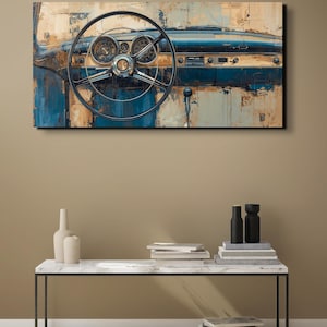 May include: An abstract painting of a classic car dashboard. The artwork features a black steering wheel, gauges, and a blue and beige colour palette. The painting is mounted on a wall above a marble-topped table.