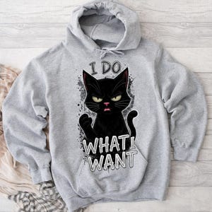 May include: A set of three ceramic mugs with a speckled, matte finish. Each mug is a different colour: light blue, cream, and grey. The mugs have a simple, modern design and a comfortable handle.