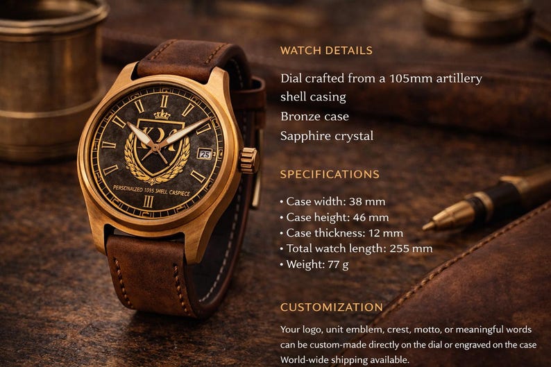 May include: A bronze wristwatch with a brown leather strap. The watch face is dark with gold detailing, including a crest and Roman numerals. The case width is 3.8 cm, and the total watch length is 25.5 cm.