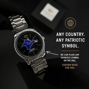 May include: A stainless steel wristwatch with a black face featuring a blue and yellow map design. The watch has a silver band and a date display. Text on the image reads: "ANY COUNTRY. ANY PATRIOTIC SYMBOL. CUSTOM MADE FOR YOU."