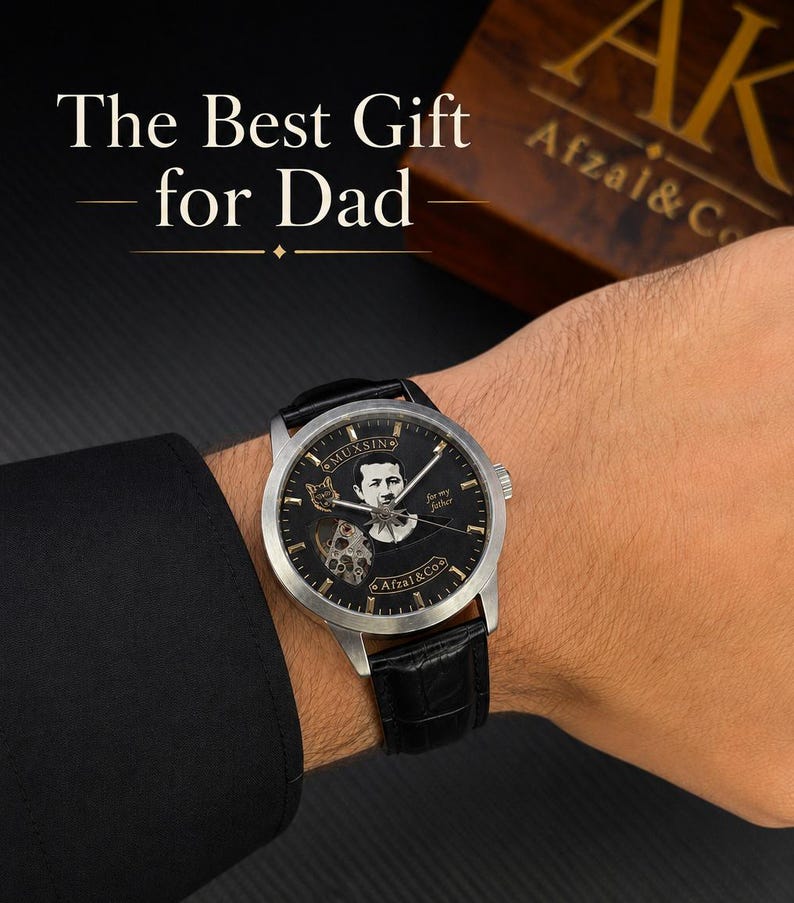May include: A silver-tone wristwatch with a black dial featuring a portrait, the text MUXSIN, Afzal & Co, and for my father, with a black leather strap. The text The Best Gift for Dad is visible above, and a wooden box with AK Afzal & Co is nearby.