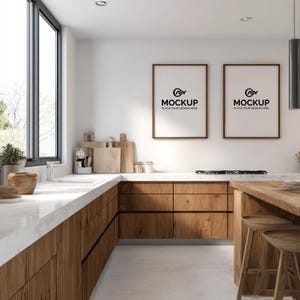 May include: A modern kitchen with wooden cabinets and a white countertop. Two framed mockups hang on the wall. The kitchen features a large window, a stove, and two wooden stools. The text on the mockups reads "MOCKUP PLACE YOUR DESIGN HERE."
