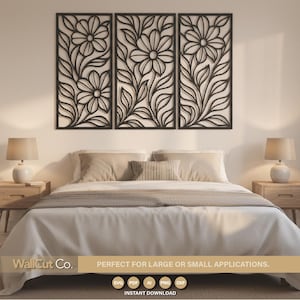 May include: Three black floral wall panels with a daisy design are mounted above a bed. The panels are rectangular and feature intricate cut-out patterns of flowers and leaves. The bedroom has neutral tones with lamps on each side of the bed.