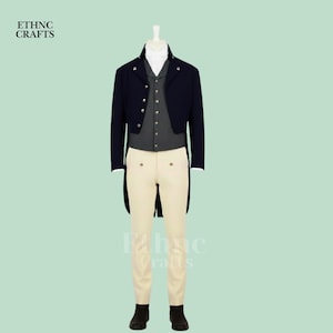 May include: A formal outfit on a mannequin. It includes a navy blue tailcoat, a gray vest, a white collared shirt, and cream-colored trousers. The outfit is completed with black boots. The text "ETHNC CRAFTS" is visible in the upper left corner.