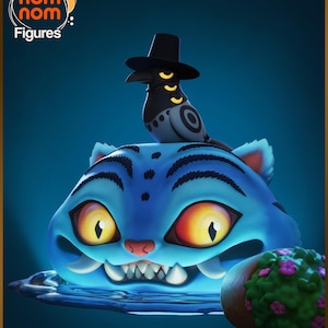 May include: A blue cat-like figure with a bird wearing a hat on top. The cat has large yellow eyes and sharp teeth. The bird is black and white with a black hat. The image has the text "nom nom Figures".