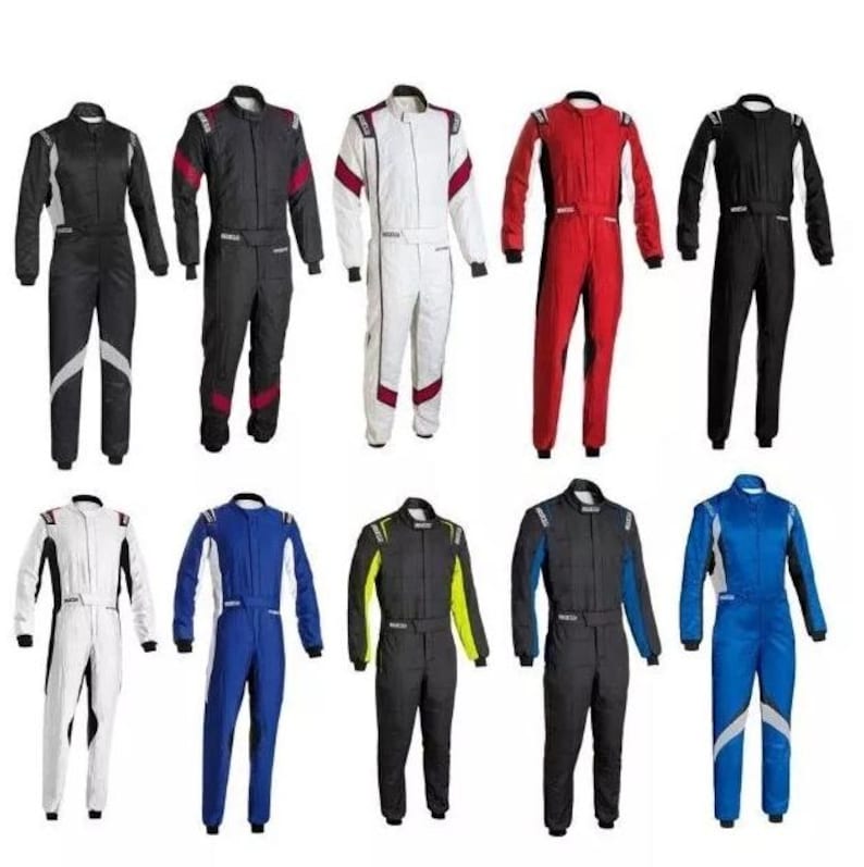 May include: A collection of racing suits in various colors, including black, white, red, and blue. Each suit features a full-body design with long sleeves and a zipper closure. Some suits have contrasting color accents on the shoulders and legs.