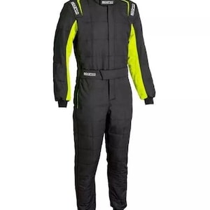 May include: Black racing suit with neon yellow accents on the sleeves and shoulders. The suit has a high collar and a belt at the waist. The Sparco logo is visible on the shoulders and chest.