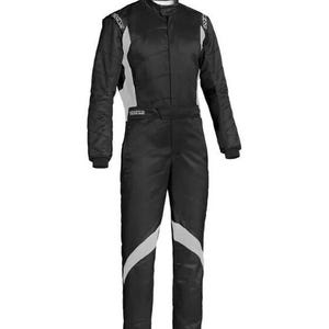 May include: Black racing suit with white accents. The suit has a high collar, long sleeves, and a full-length zipper. The Sparco logo is visible on the shoulders and chest. The suit is designed for motorsports.